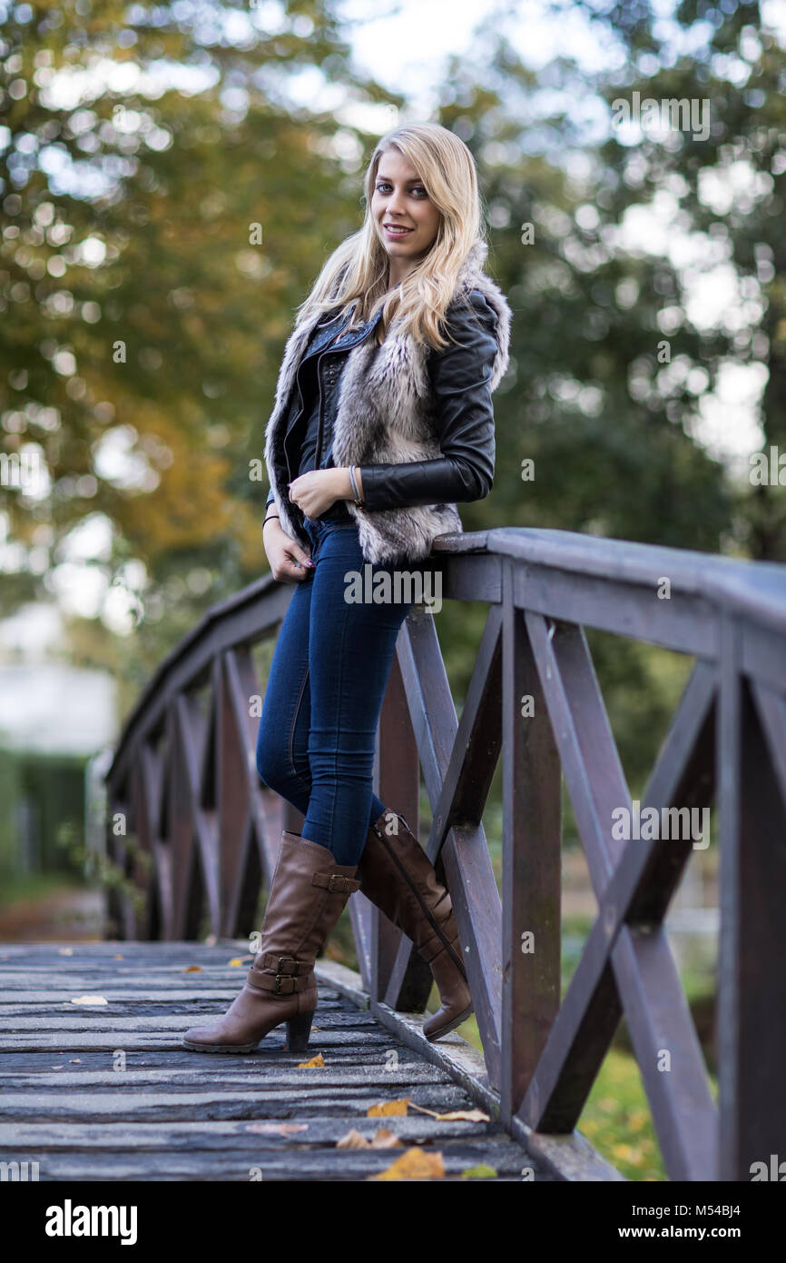 Young blond woman in autumnal outfit Stock Photo