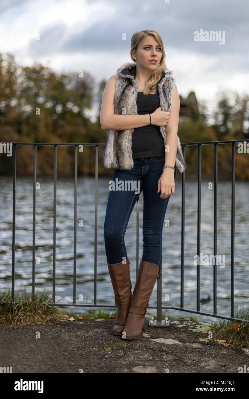 Young blond woman in autumnal outfit Stock Photo