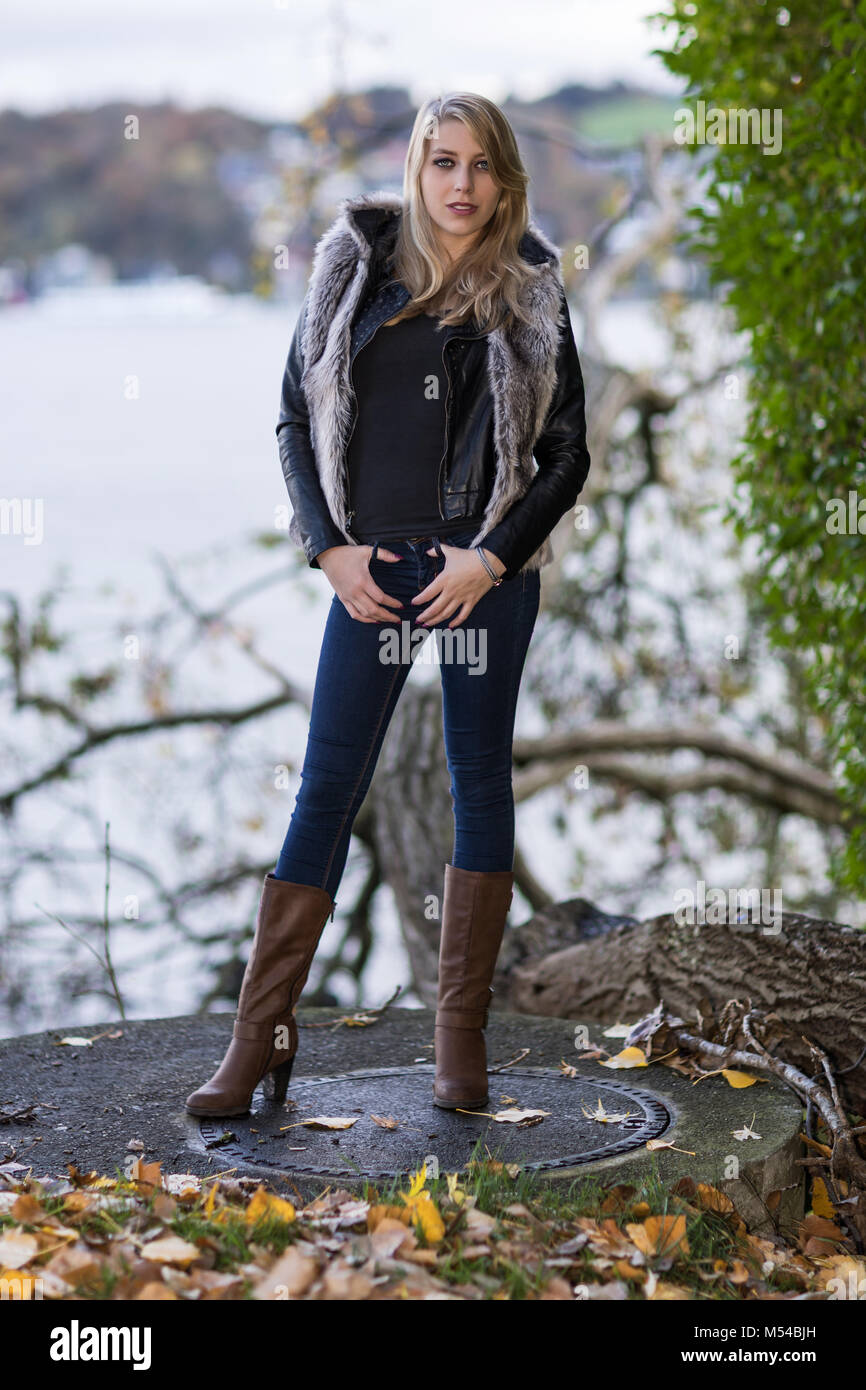 Young blond woman in autumnal outfit Stock Photo