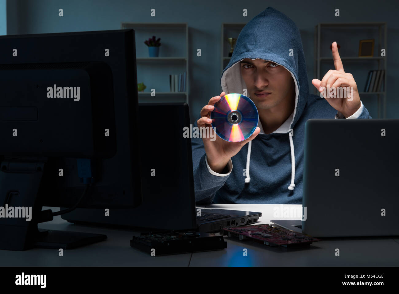 Hacker hacking computer at night Stock Photo - Alamy