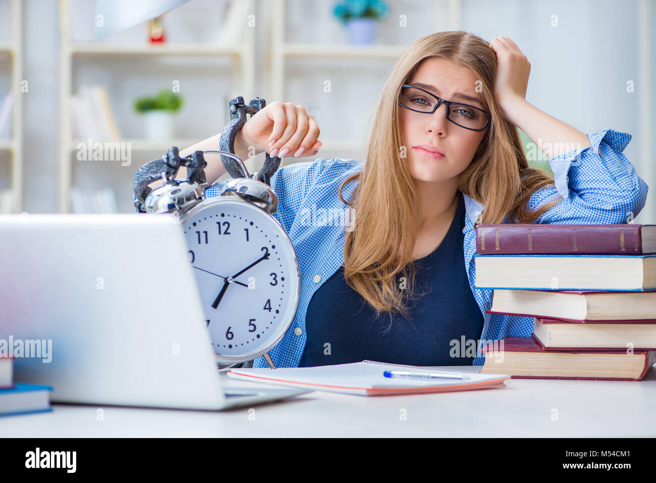 Young teenage female student preparing for exams at home Stock Photo ...