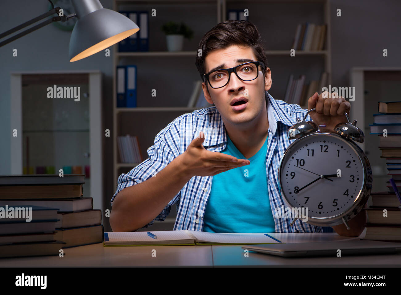 Student preparing for exams late night at home Stock Photo - Alamy