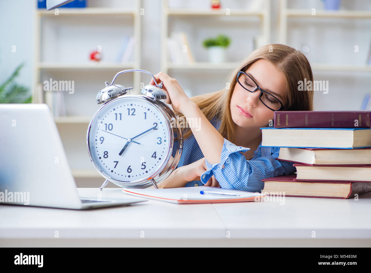 Young teenage female student preparing for exams at home Stock Photo ...