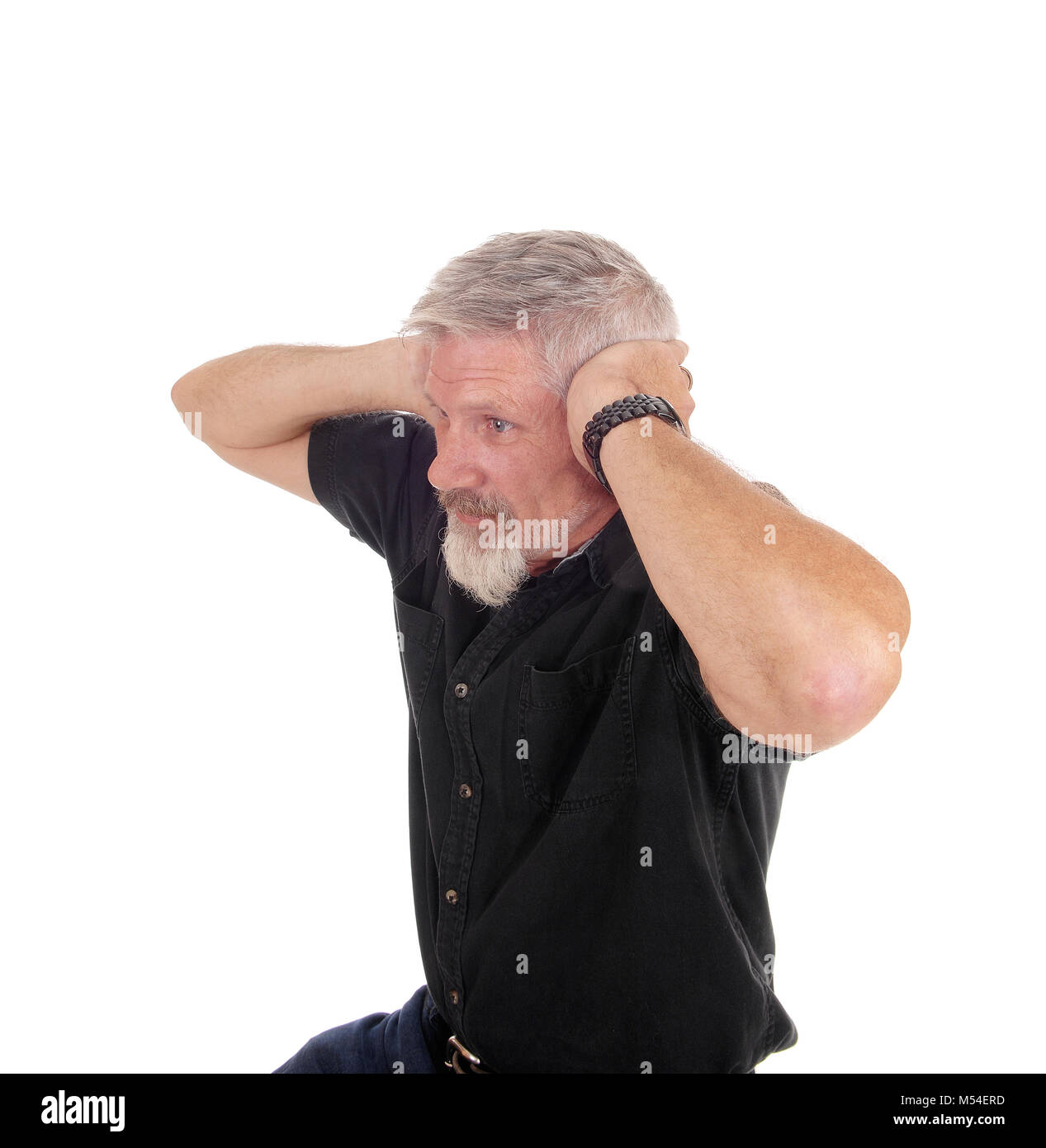 Man holding his hands over his ears Stock Photo
