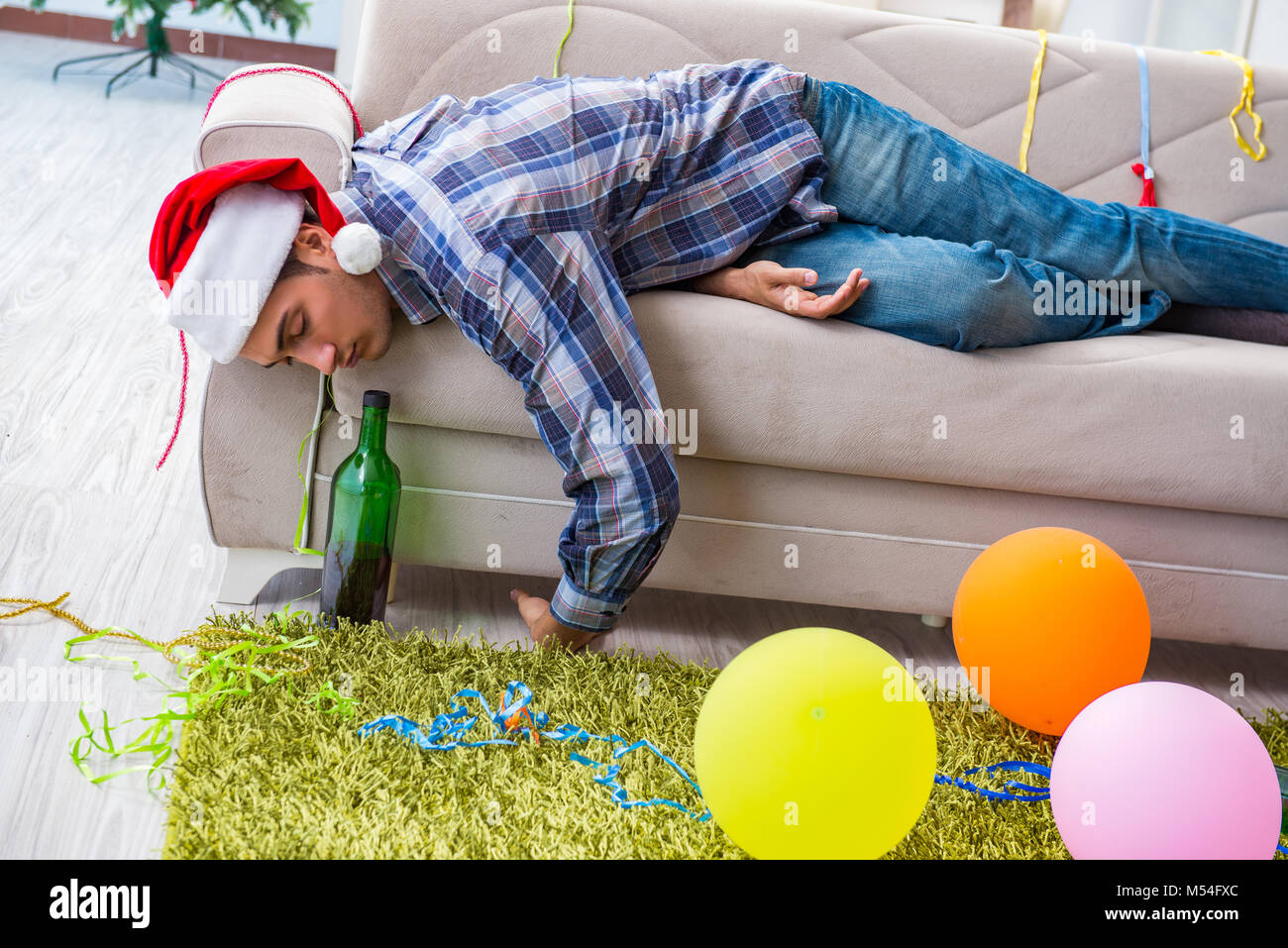 Man having hangover after christmas party Stock Photo Alamy