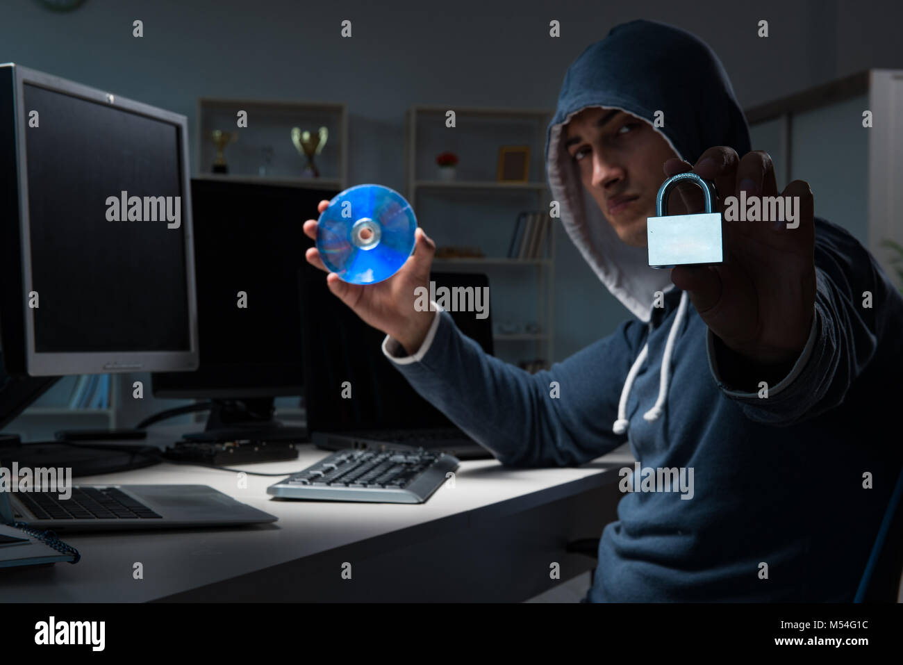 Hacker hacking computer at night Stock Photo - Alamy