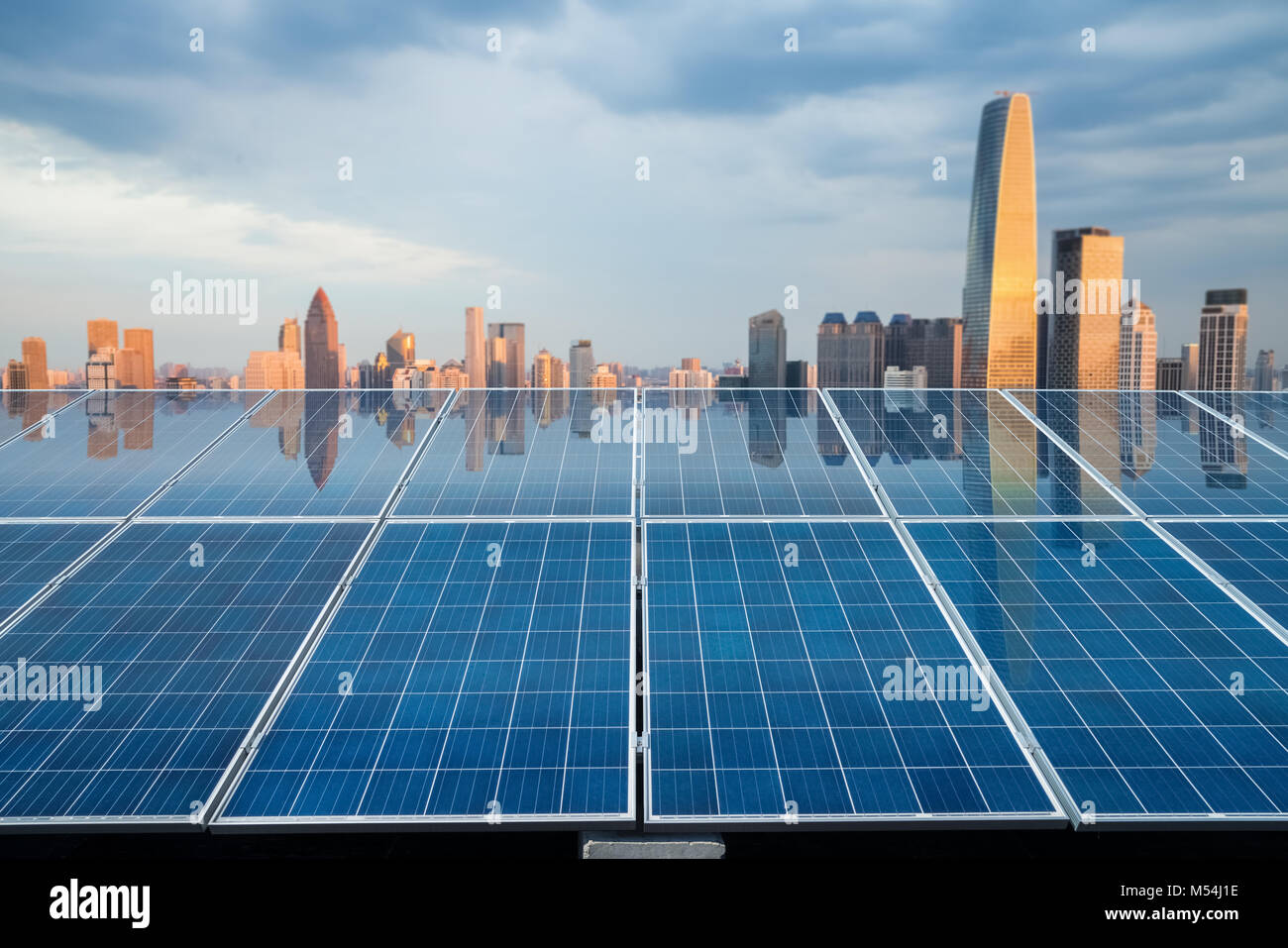 solar energy panel with city twilight Stock Photo