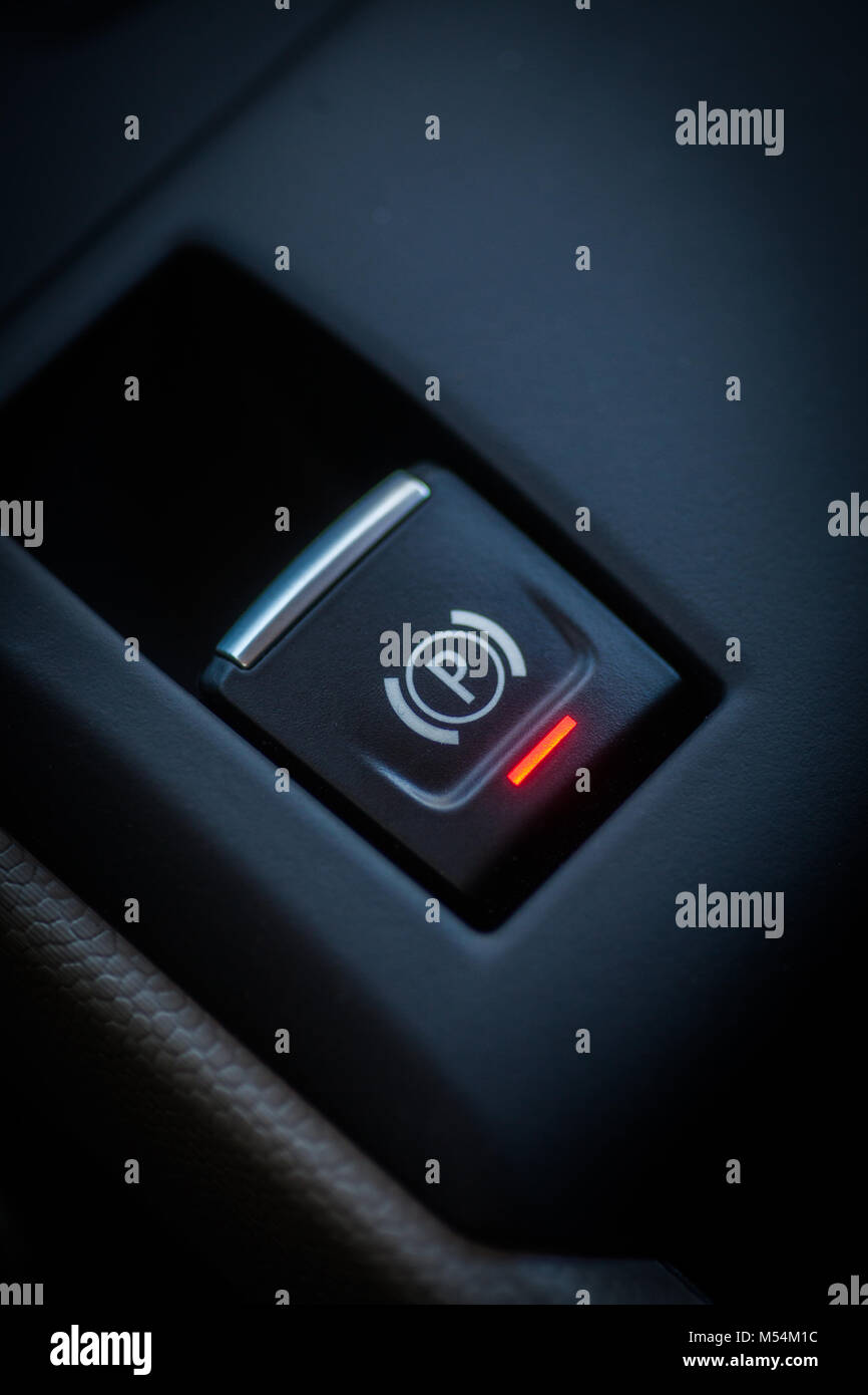 Close up shot of a parking brake button in a car Stock Photo Alamy
