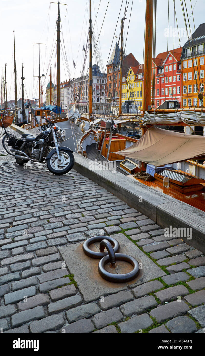 The motorcycle on the Nyhavn paving stone pavement in Copenhagen. Stock Photo
