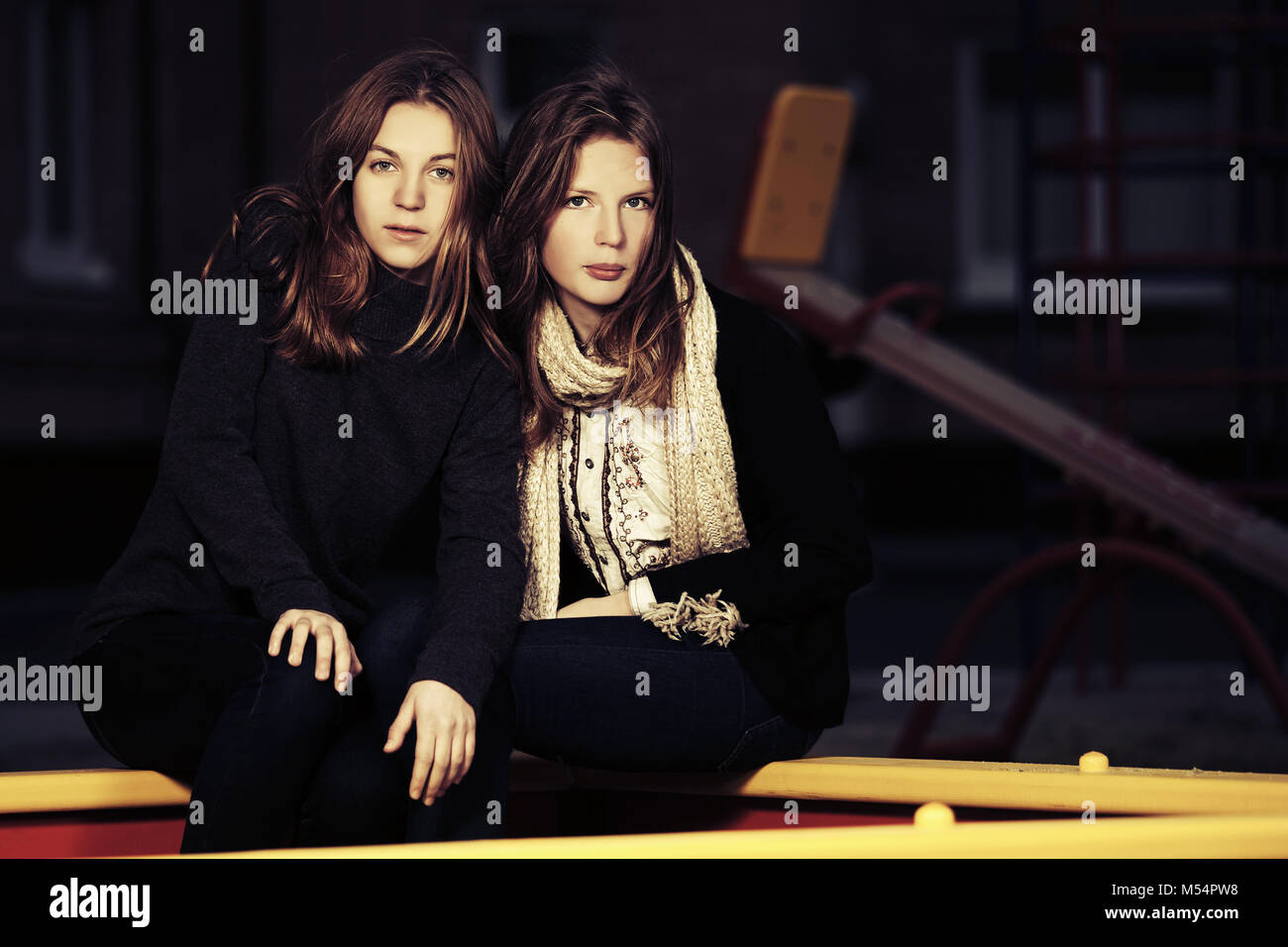 Two happy teen girls on the playground Stock Photo - Alamy