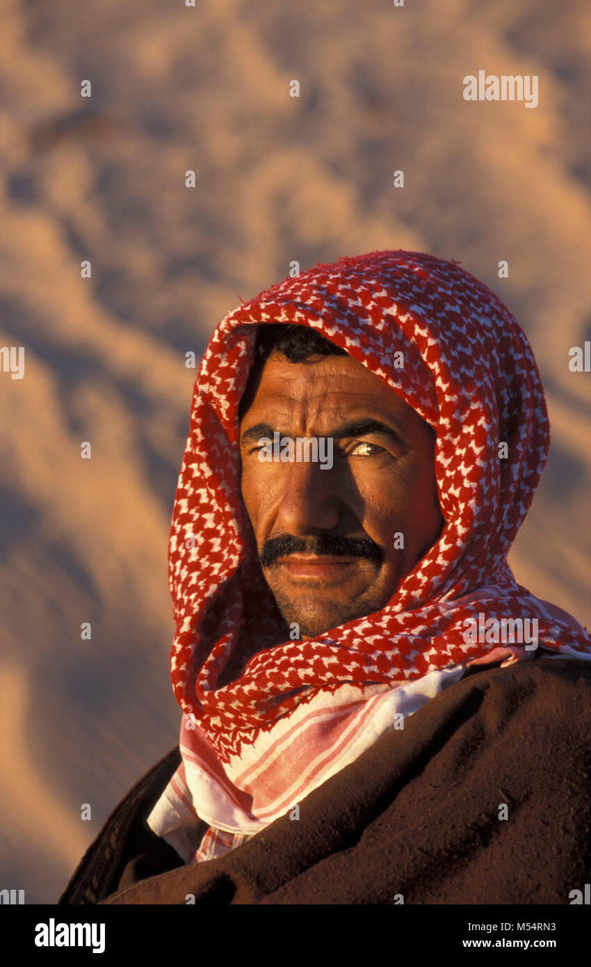 Algeria. Near Touggourt. The Eastern Sand Sea. Grand Erg Oriental. Sahara desert. Portrait of Bedouin man. Stock Photo