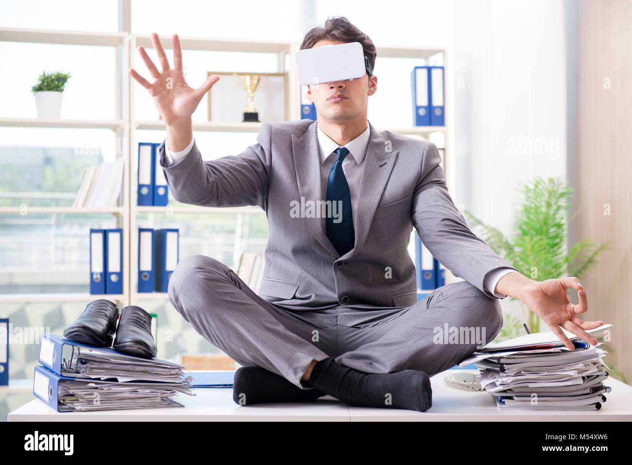 The businessman with vr virtual reality glasses in office Stock Photo ...