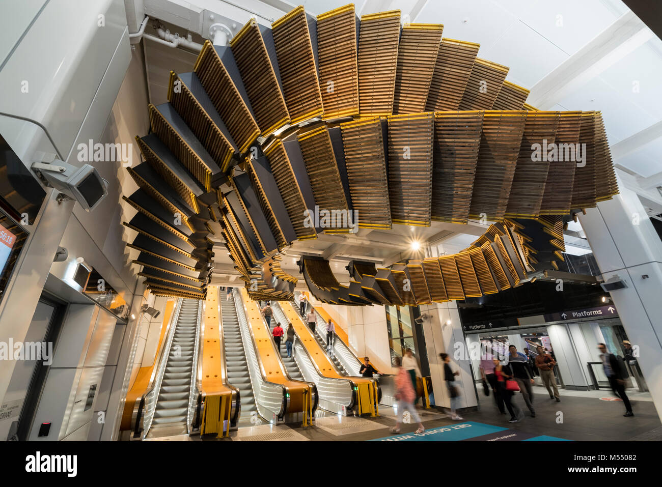 Large looping sculpture of the old original wooden escalator by sculptor Chris Fox at Wynyard Station, Sydney Stock Photo