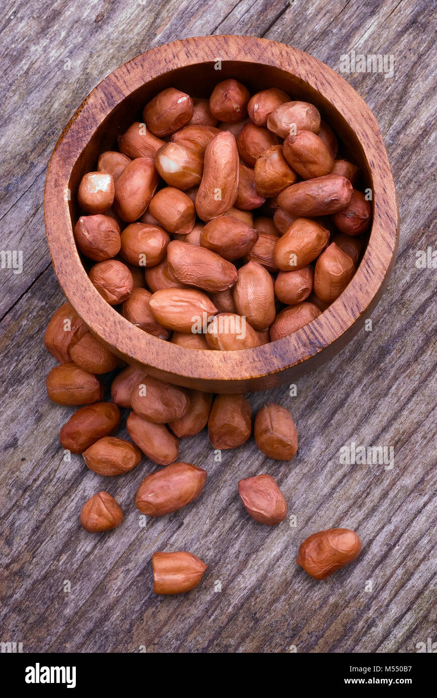 Shelled peanuts (Arachis hypogaea), legumes used for human consumption and animal feed. Stock Photo