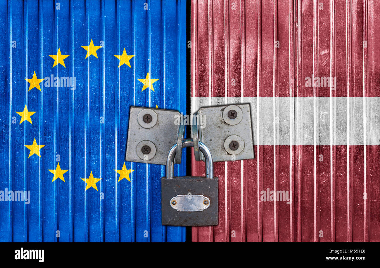 EU and Latvia flag on door with padlock Stock Photo