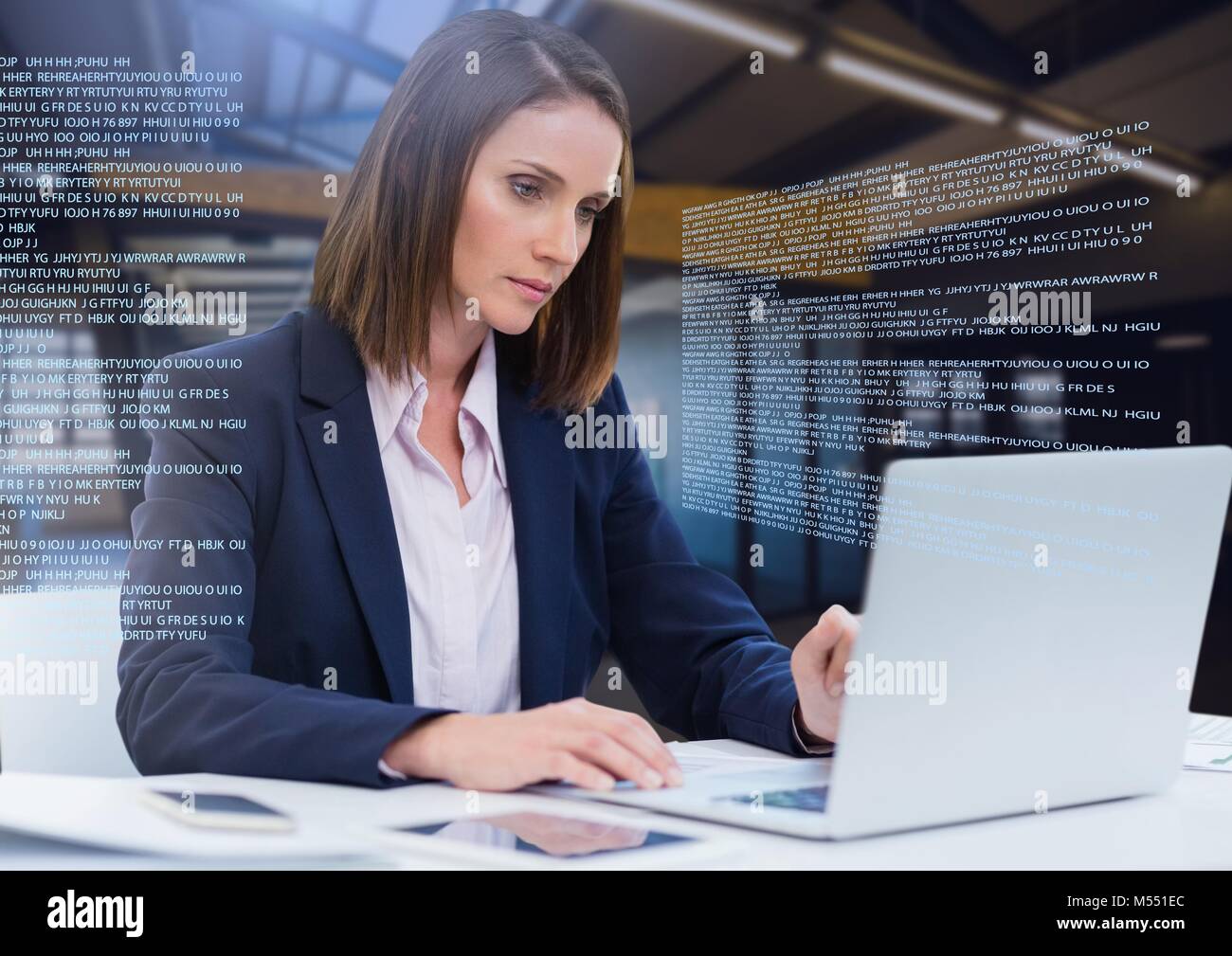 Businesswoman working on laptop with screen text interface Stock Photo