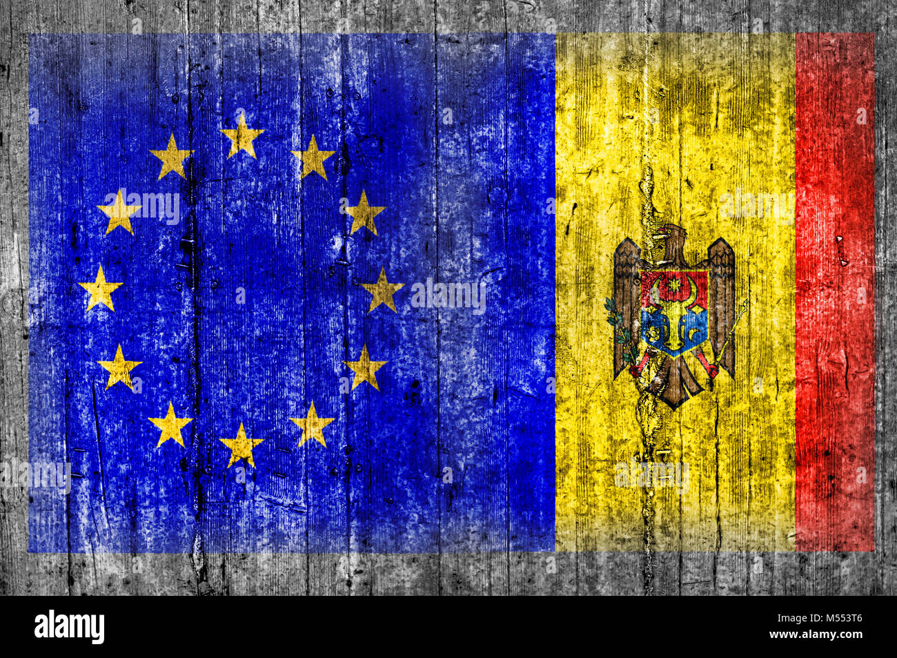 EU and Moldova flag on concrete wall Stock Photo