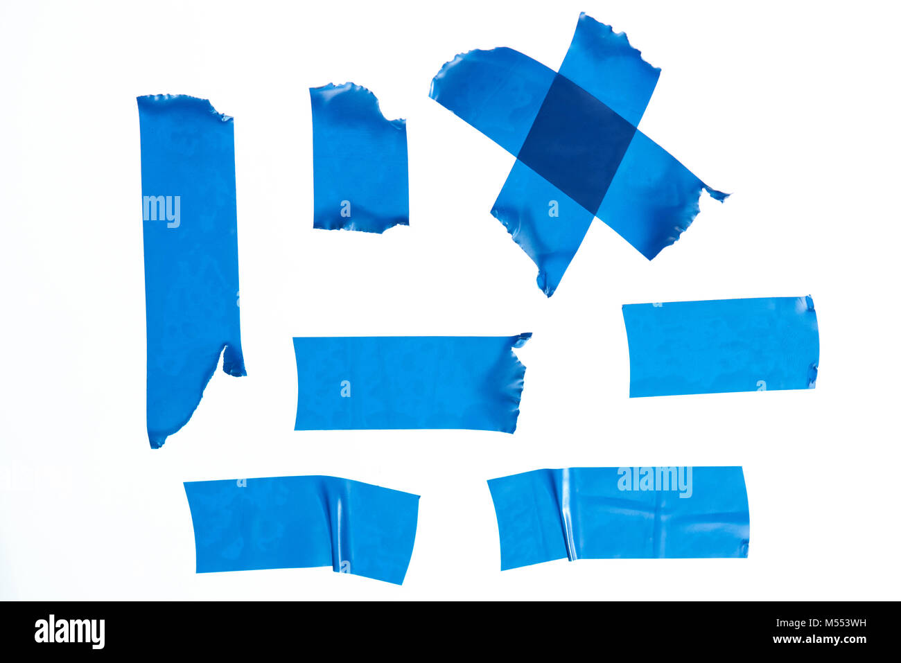 Set of blue masking tape pieces isolated on white background Stock