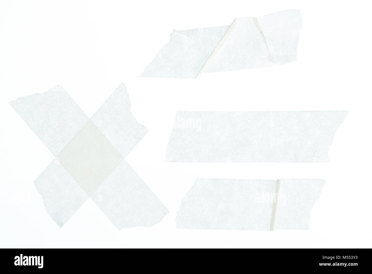 Set of white wrinkled masking tape pieces close up isolated Stock Photo