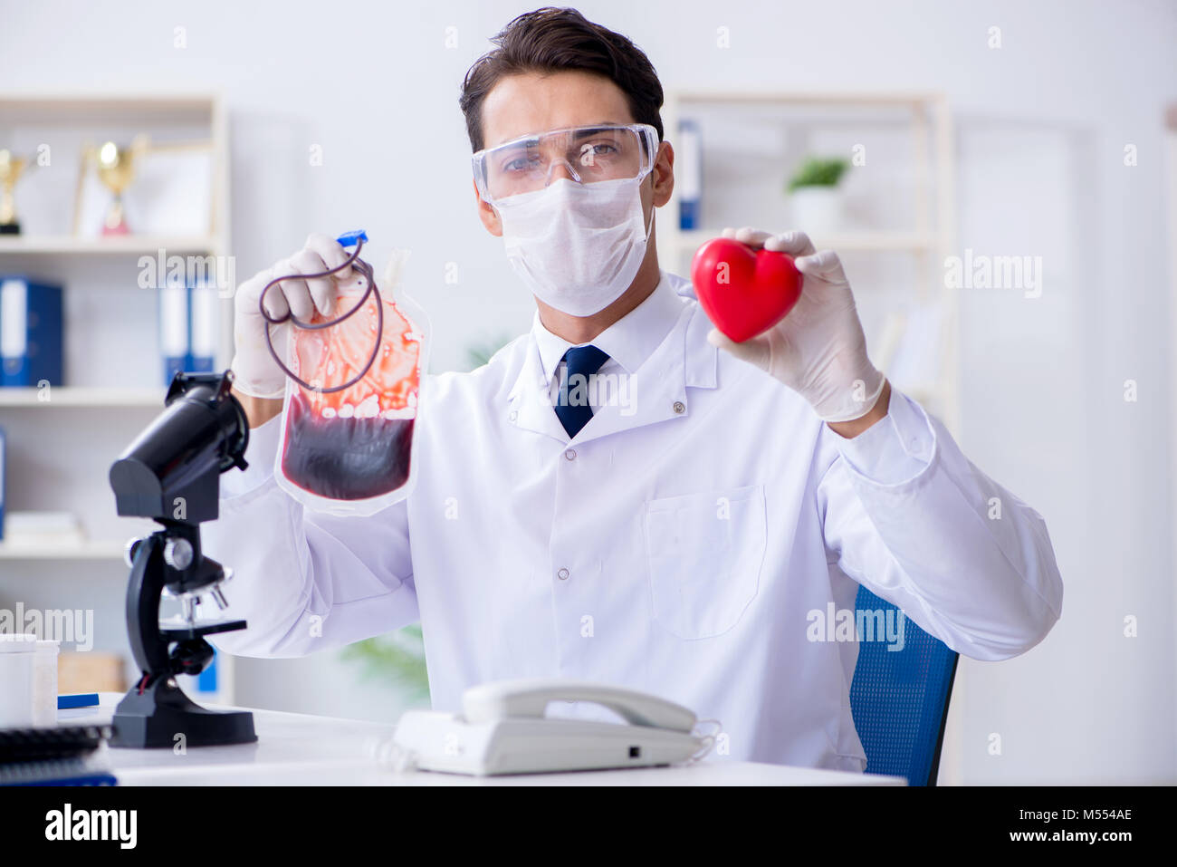 Doctor working with blood samples in hospital clinic lab Stock Photo
