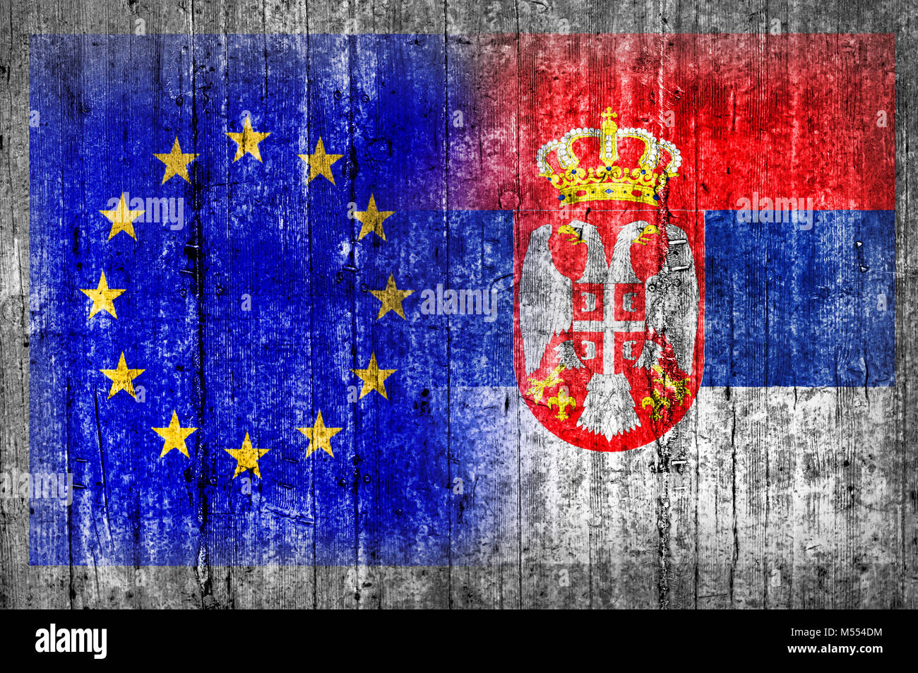 EU and Serbia flag on concrete wall Stock Photo