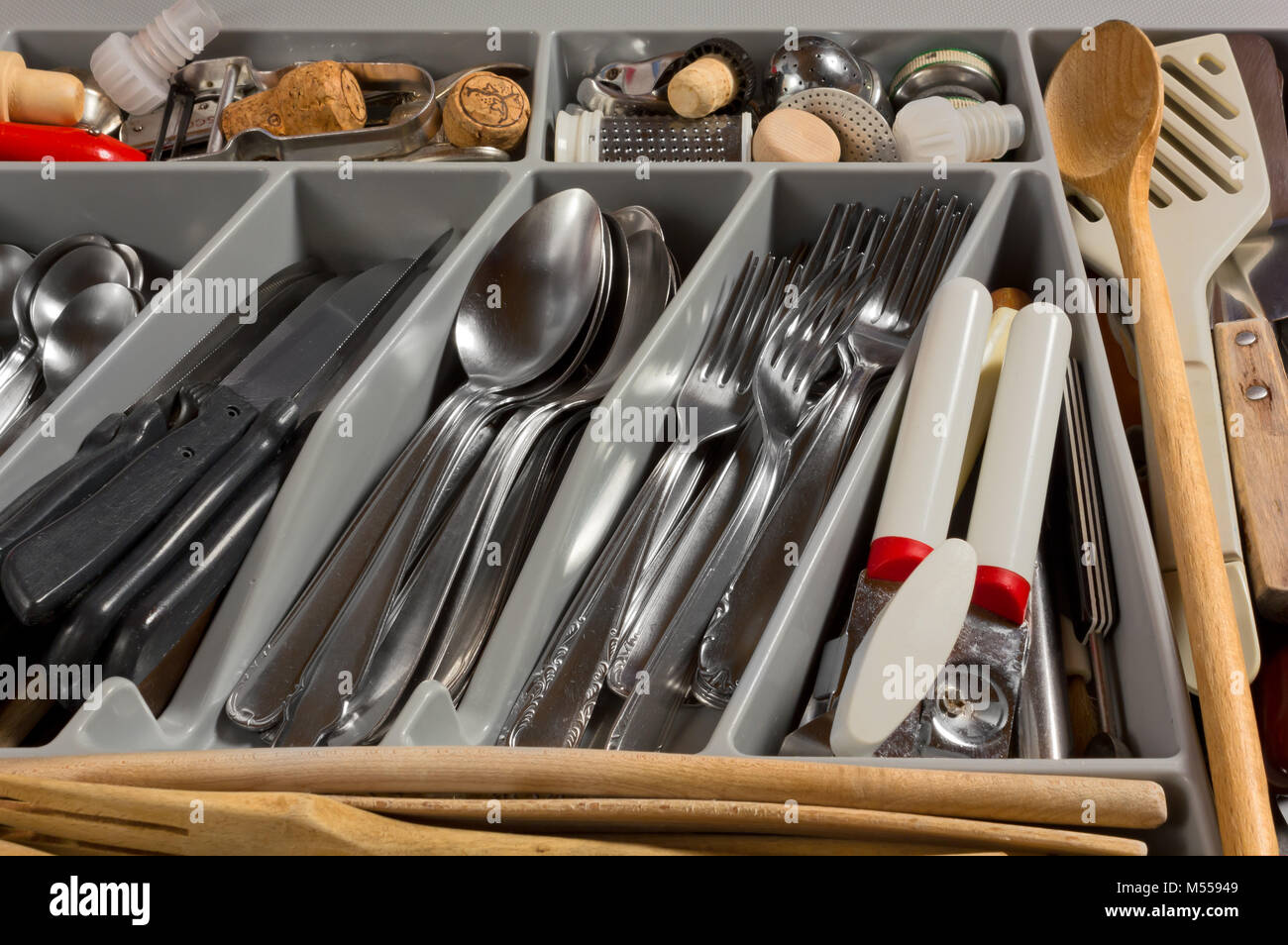 Closeup of the contents of a kitchen drawer full of cutlery and utensils Stock Photo Alamy