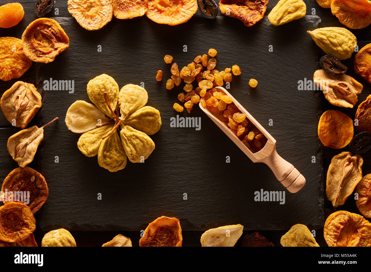 Dried fruits on slate plate Stock Photo Alamy