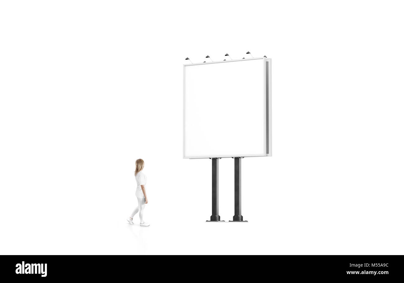 Woman stand beside blank white banner mockup on city square billboard. Empty bill board mock up isolated. Clear template on sity street sign. Outdoor  Stock Photo