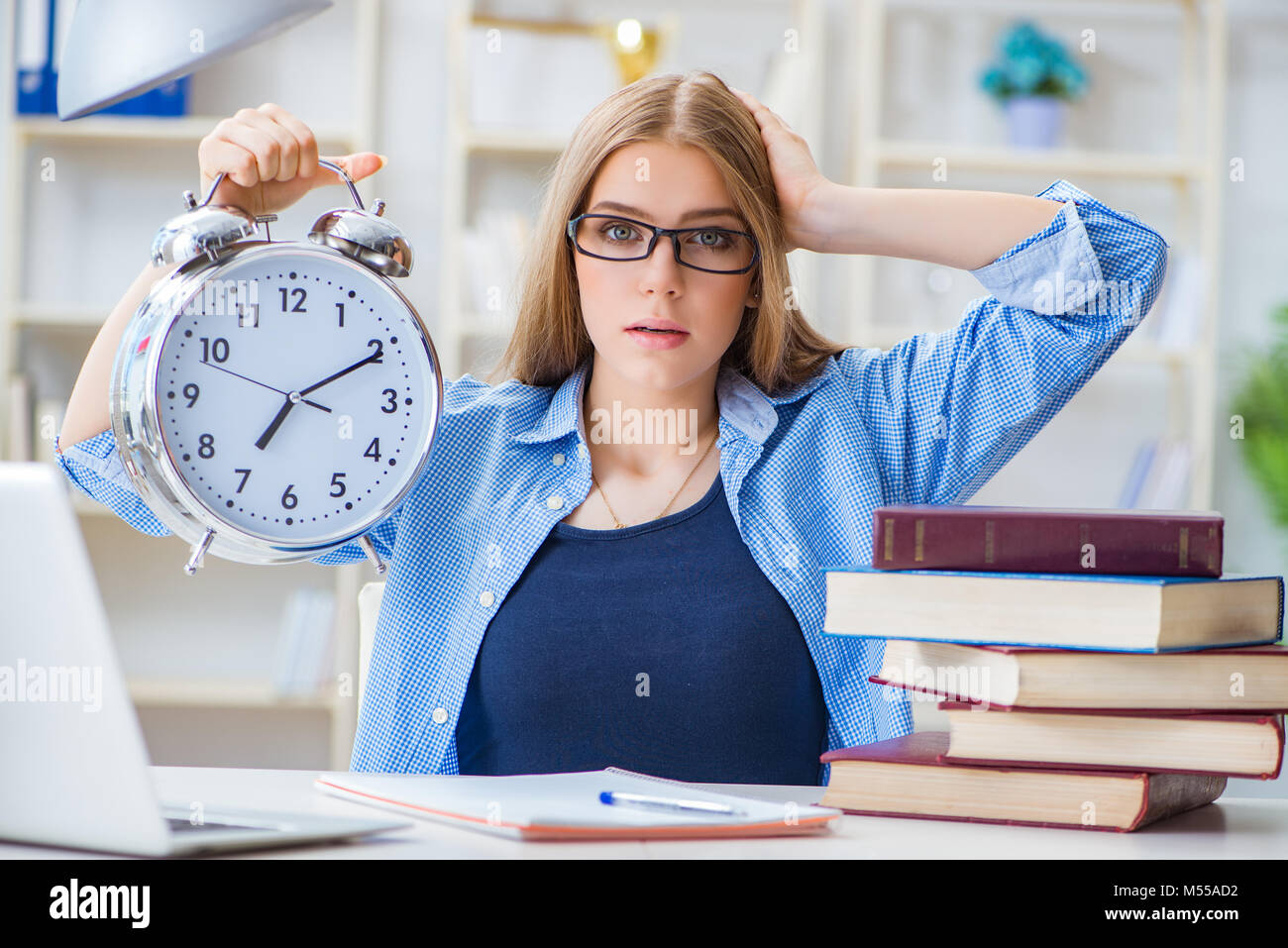 Young teenage female student preparing for exams at home Stock Photo ...