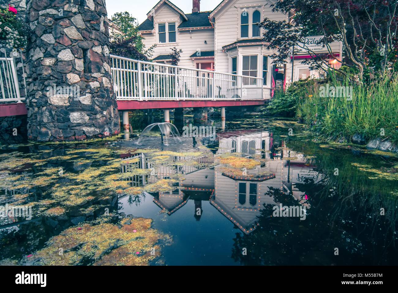 beautiful historic home details and nature pond with reflection Stock Photo
