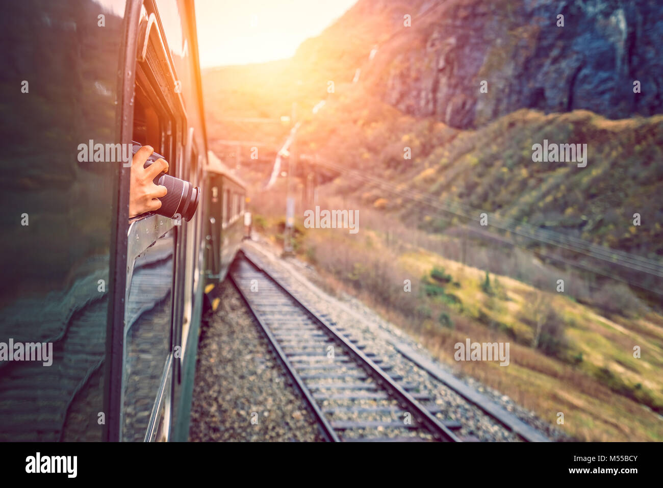 Taking pictures of landscape from a train window Stock Photo - Alamy