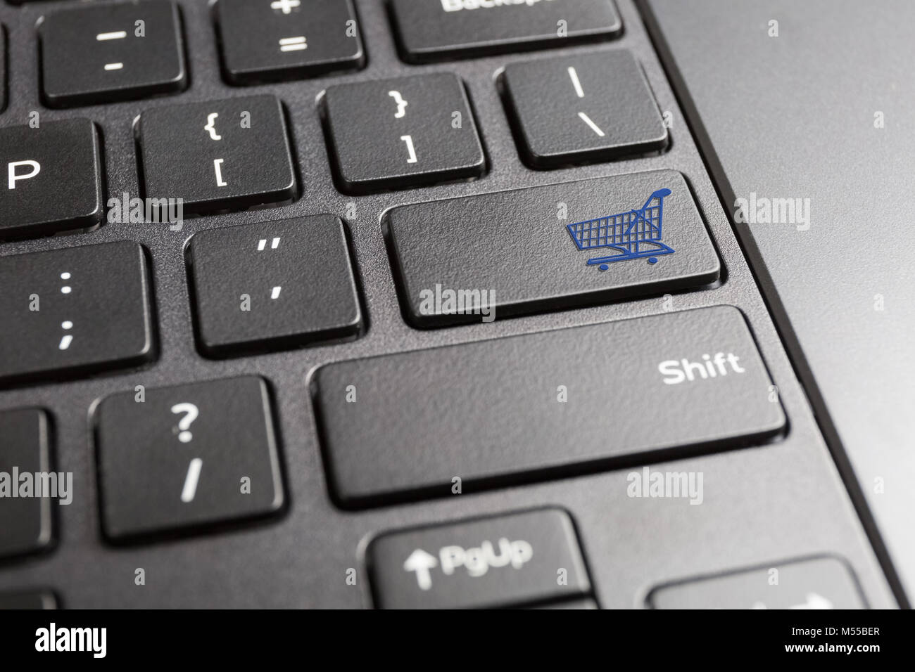 computer keyboard with shopping cart icon Stock Photo