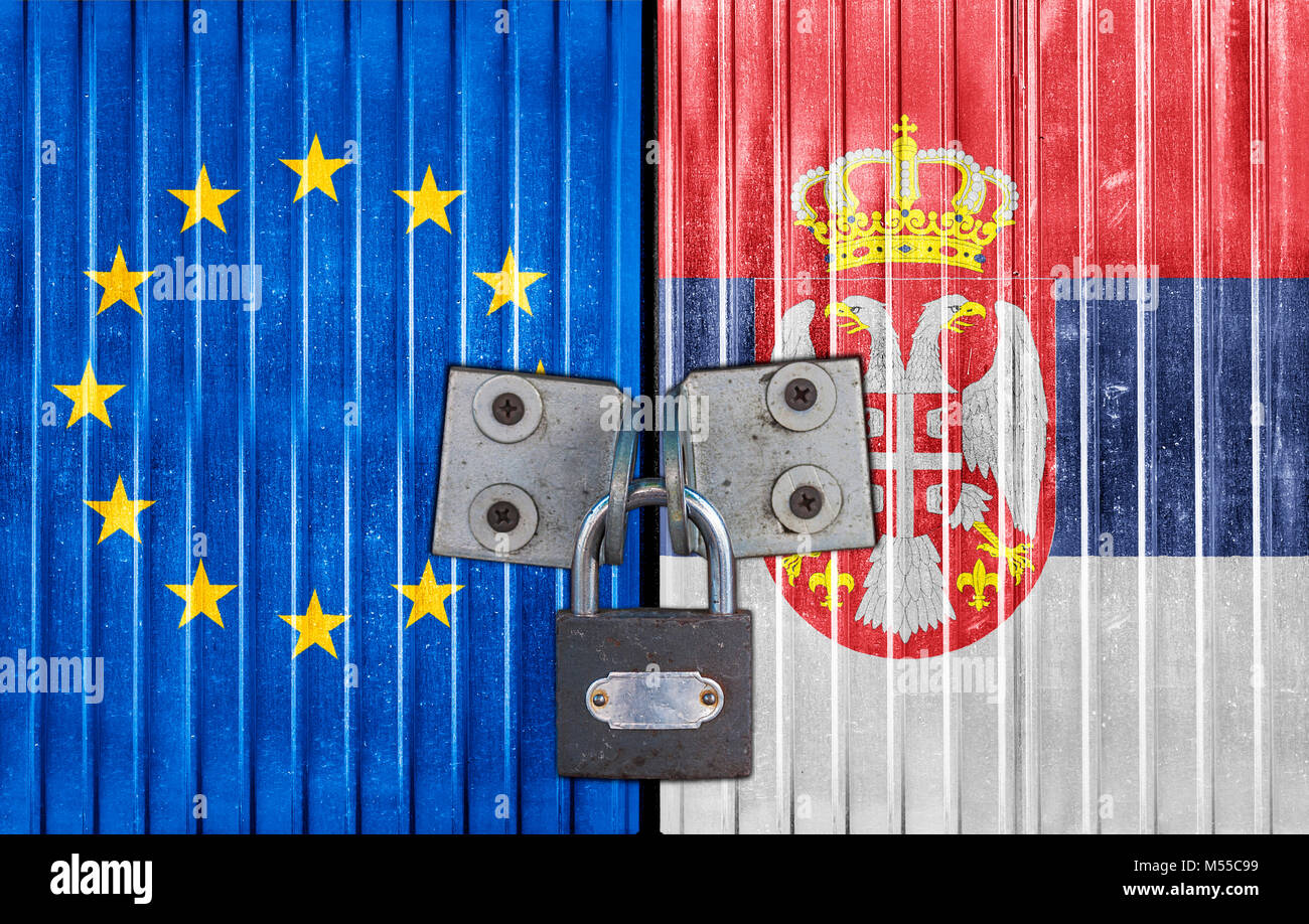 EU and Serbia flag on door with padlock Stock Photo