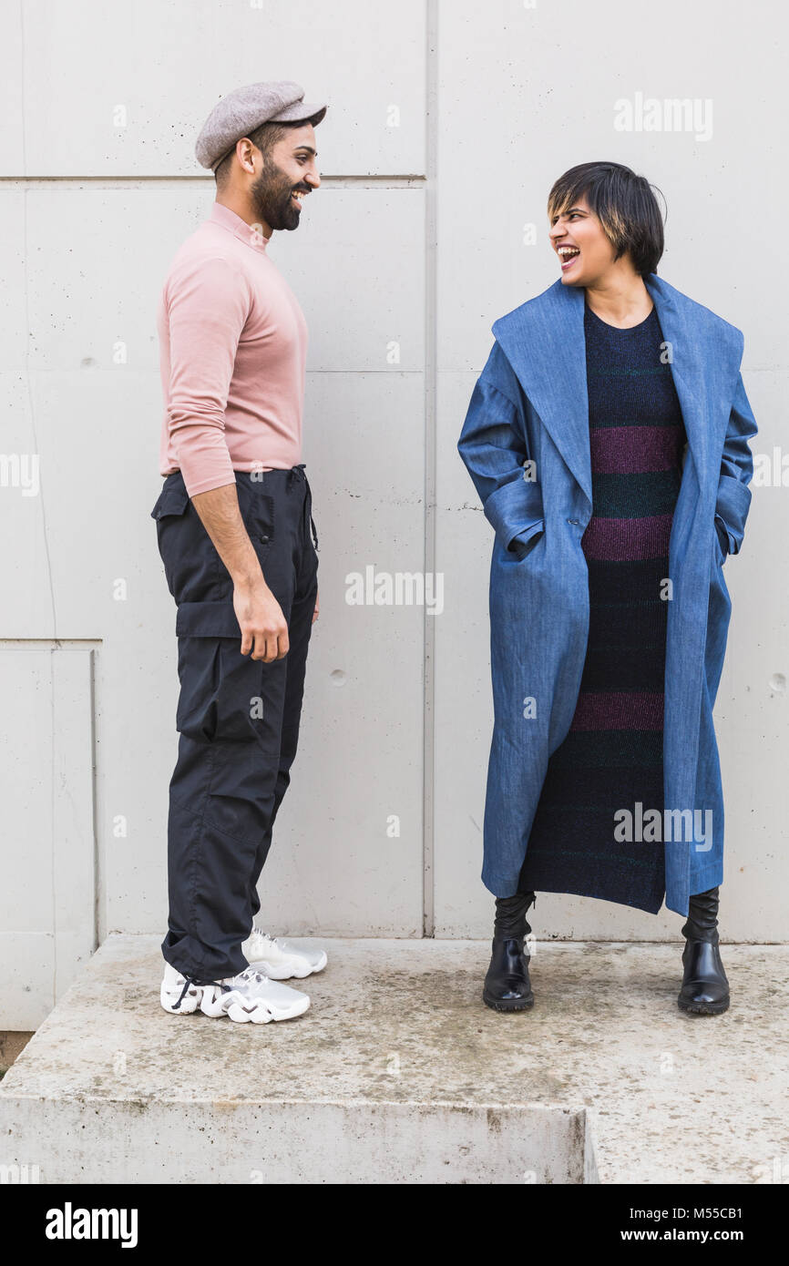 Beautiful Indian couple posing in an urban context. Street fashion and style. Stock Photo