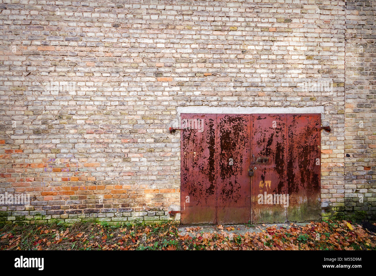 Old rusty metal gate in brick wall Stock Photo Alamy