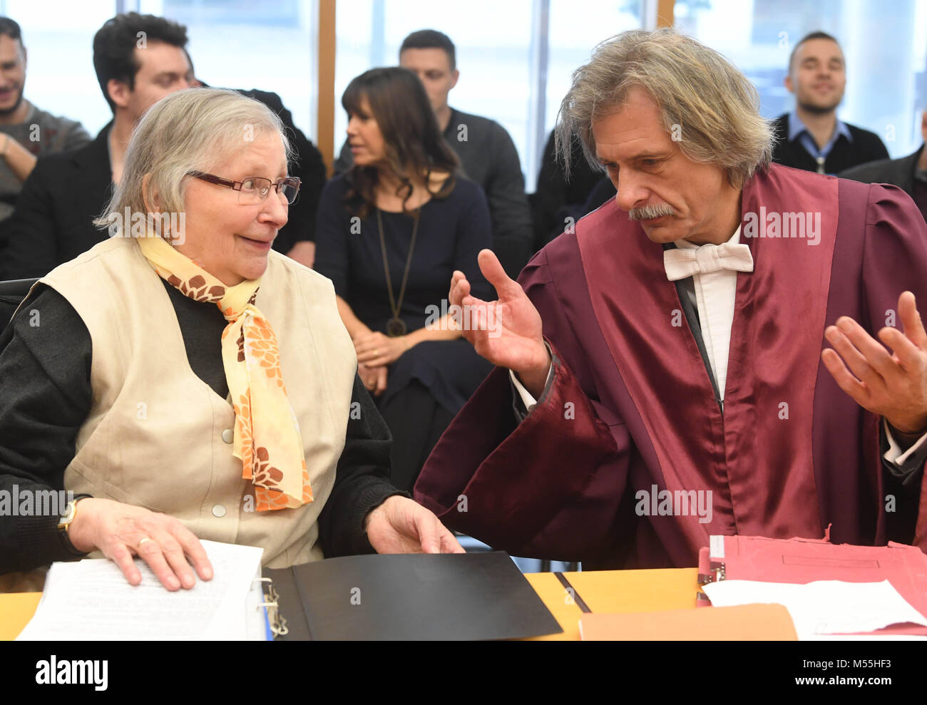 20 February 2018, Germany, Karlsruhe: Marlies Kraemer waits for the beginning of her trial at the Federal Supreme Court (BGH) with her lawyer Wendt Nassall. The sixth civil senate stands in the background: Oliver Klein (L-R), Vera von Pentz, Gregor Galke, Stefanie Roloff und Peter Allgayer. The pensioner filed a lawsuit that Sparkasse is to name the female term of 'Kontoinhaber' (lit. account holder), being 'Kontoinhaberin' on their forms. Photo: Uli Deck/dpa Stock Photo