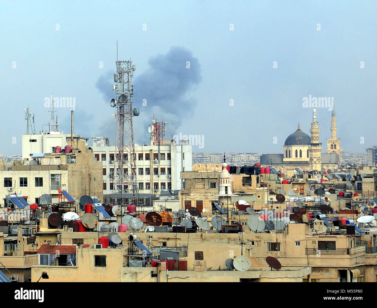 Damascus. 20th Feb, 2018. Smoke is seen in some areas in Damascus, capital of Syria, on Feb.20, 2018. Tens of people have been taken to the hospitals Tuesday due to the intensified rebels' mortar attack that targeted several parts of Damascus as part of an onging military showdown between the rebels and the government forces. Credit: Ammar Safarjalani/Xinhua/Alamy Live News Stock Photo