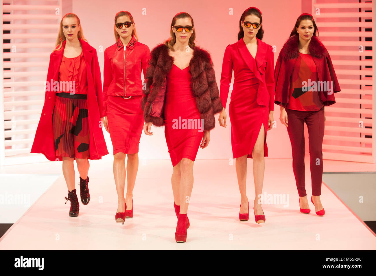 Fashion models during the Red Alert catwalk sequence at Moda. The trade fashion show ran 18th-20th February 2018 at the NEC, Birmingham, UK. Key trends highlighted for Autumn/Winter 2018  included red and burgundy, often in conjunction with black, and a major return for leopard print. Three separate catwalk shows, Moda Directions, Moda Gent, and Moda Woman, took place every day. Credit: Antony Nettle/Alamy Live News Stock Photo