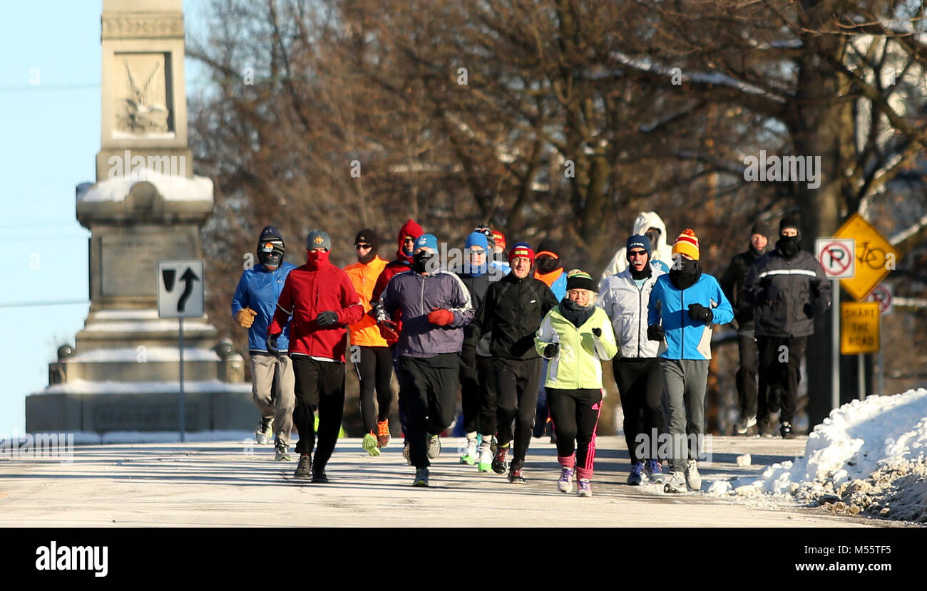 Davenport, Iowa, USA. 31st Dec, 2017. Members of the Corn Belt Running Club jog down Main Street by Central High School, Monday, January 1, 2017, during their annual New Year's Day run. Temperture at the time of the run was around 15 below zero with a slight wind. Credit: John Schultz/Quad-City Times/ZUMA Wire/Alamy Live News Stock Photo