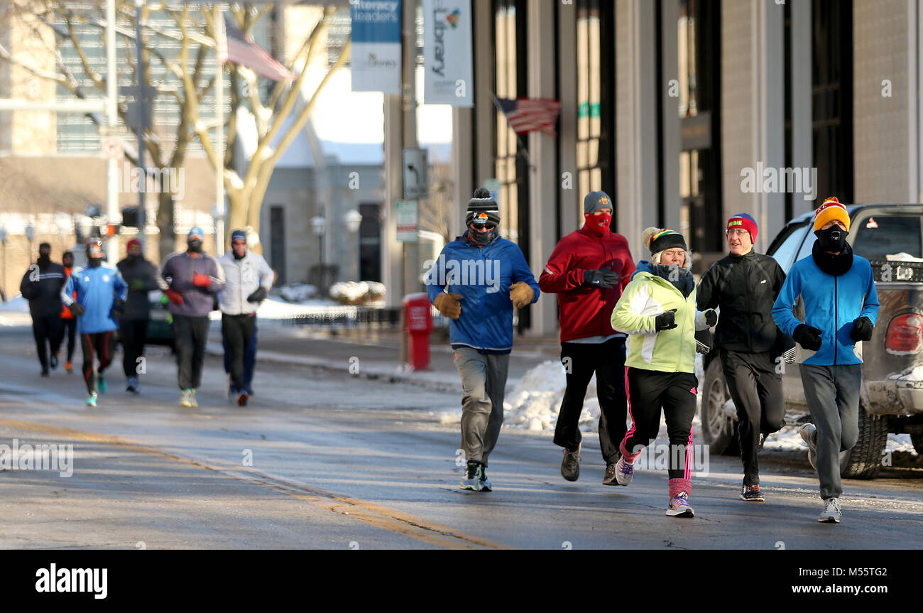 Davenport, Iowa, USA. 31st Dec, 2017. Members of the Corn Belt Running Club jog down Main Street by the public library, Monday, January 1, 2017, during their annual New Year's Day run. Temperture at the start of the run was around 15 below zero with a slight wind. Credit: John Schultz/Quad-City Times/ZUMA Wire/Alamy Live News Stock Photo