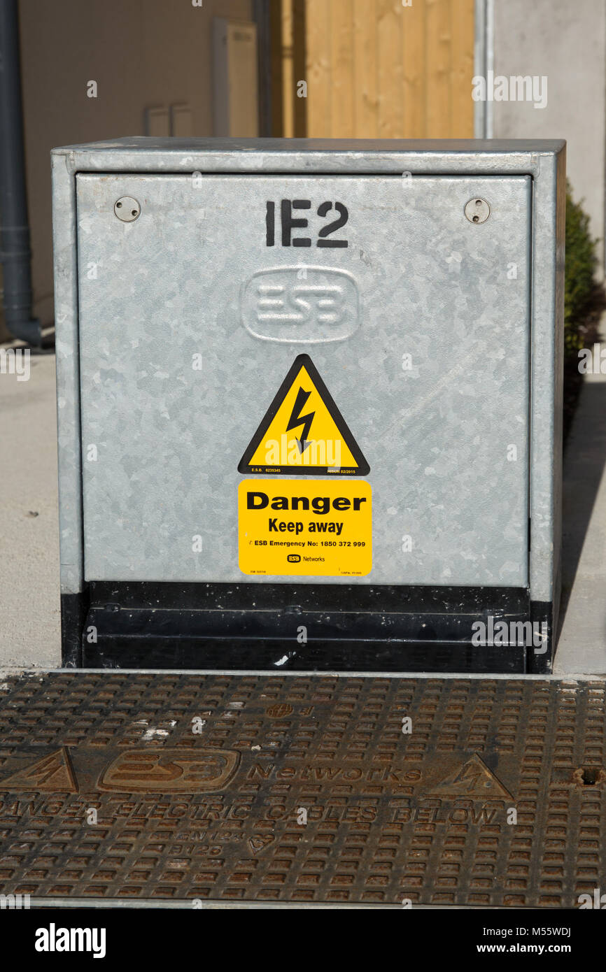 Maynooth, County Kildare, Ireland. 20 Feb 2018: EBS minipillar box with electricity installations labeld with hazard symbols for public safety. Stock Photo