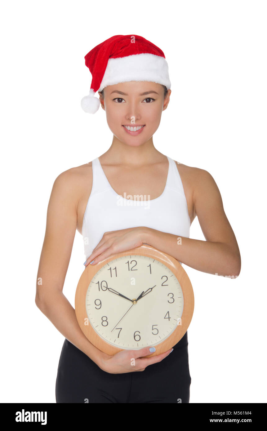 beautiful asian women in a Santa's hat with a clock Stock Photo