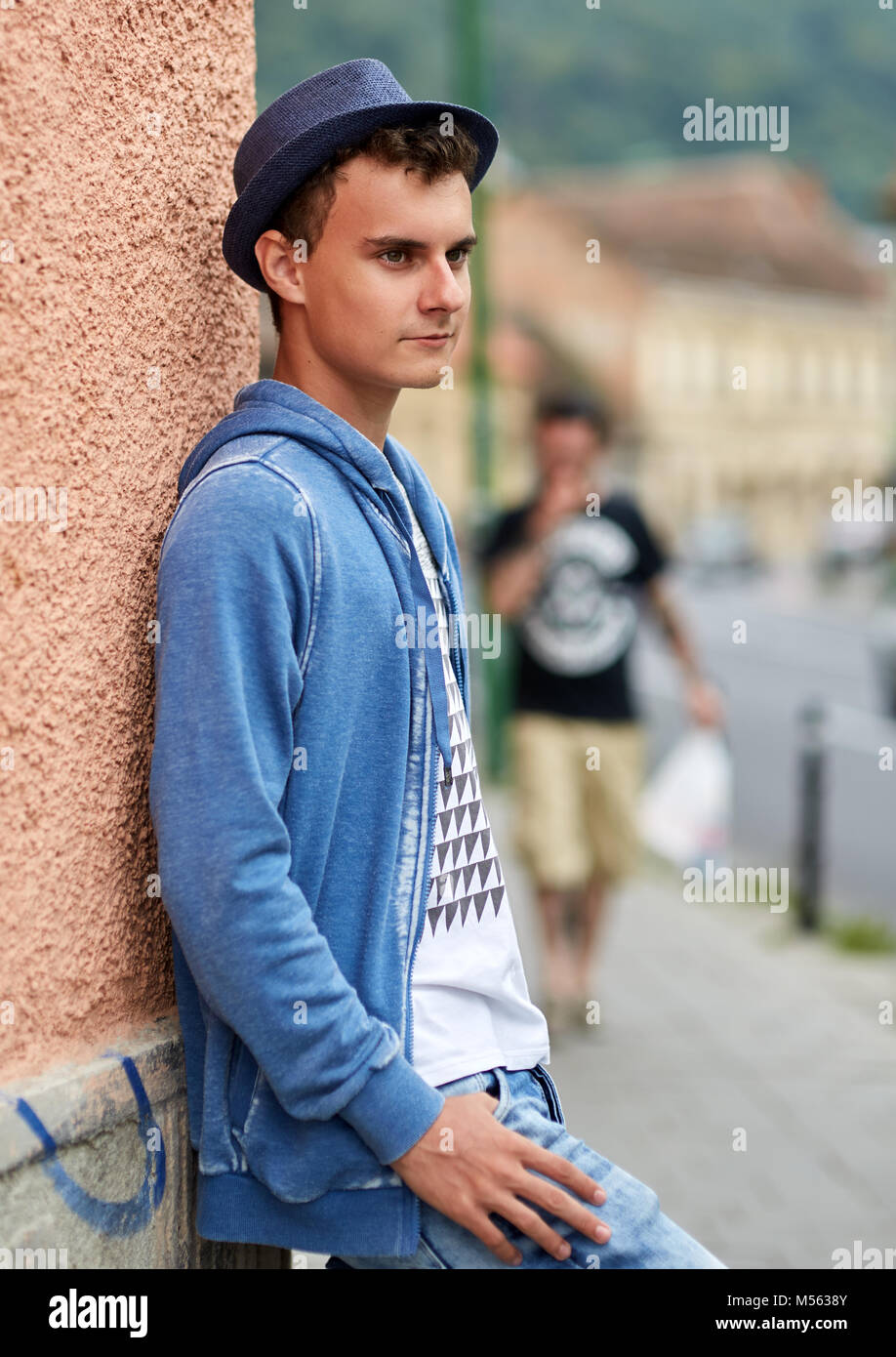 Closeup of a handsome teenage boy in an urban environment Stock Photo ...