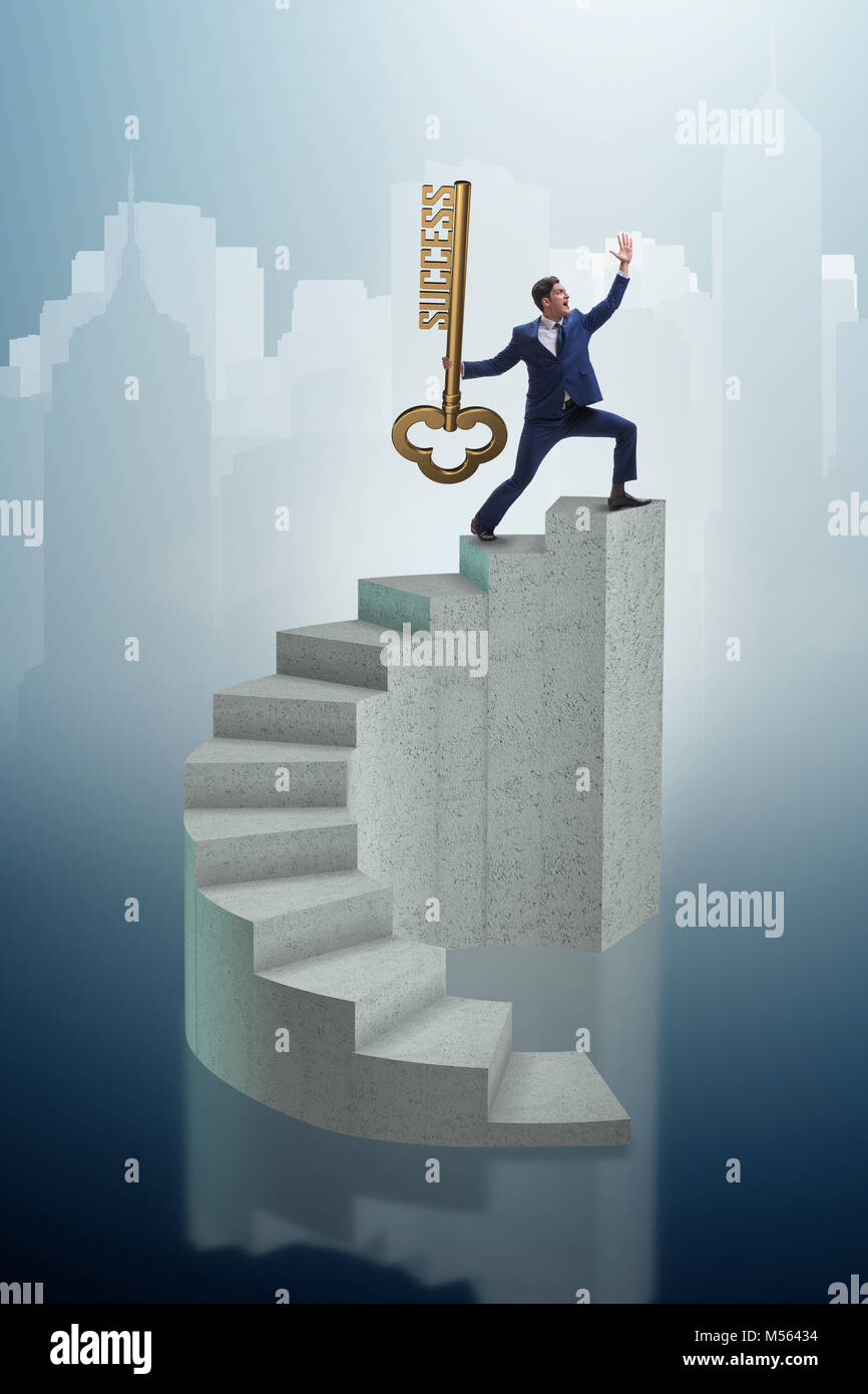 Businessman with key to success at the top of career Stock Photo - Alamy