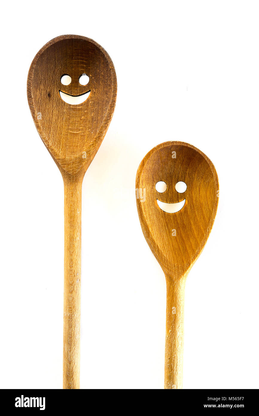 Wooden smiley face spoons on white background Stock Photo - Alamy