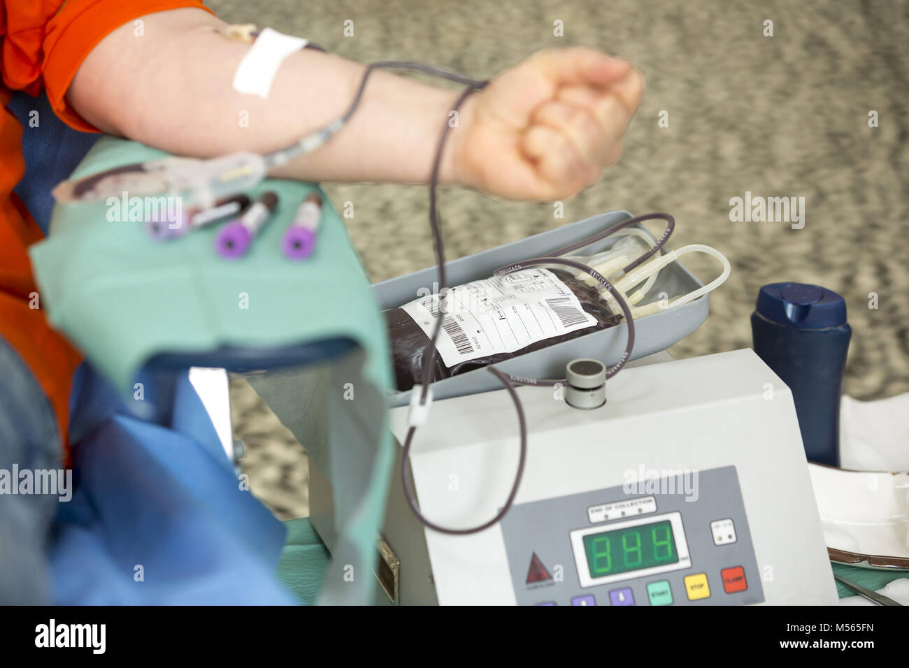 Blood donation hand. Blood bag Stock Photo