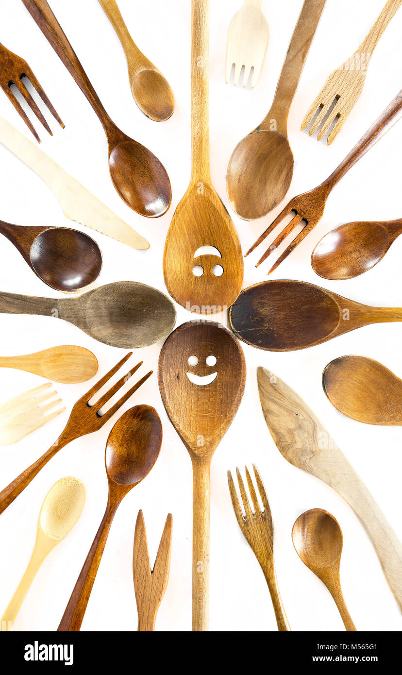 Wooden smiley face spoons on white background Stock Photo - Alamy
