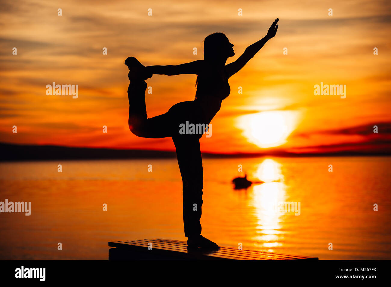 Carefree woman meditating in nature.Finding inner peace.Yoga practice.Spiritual healing lifestyle.Enjoying peace,anti-stress therapy,mindfulness medit Stock Photo