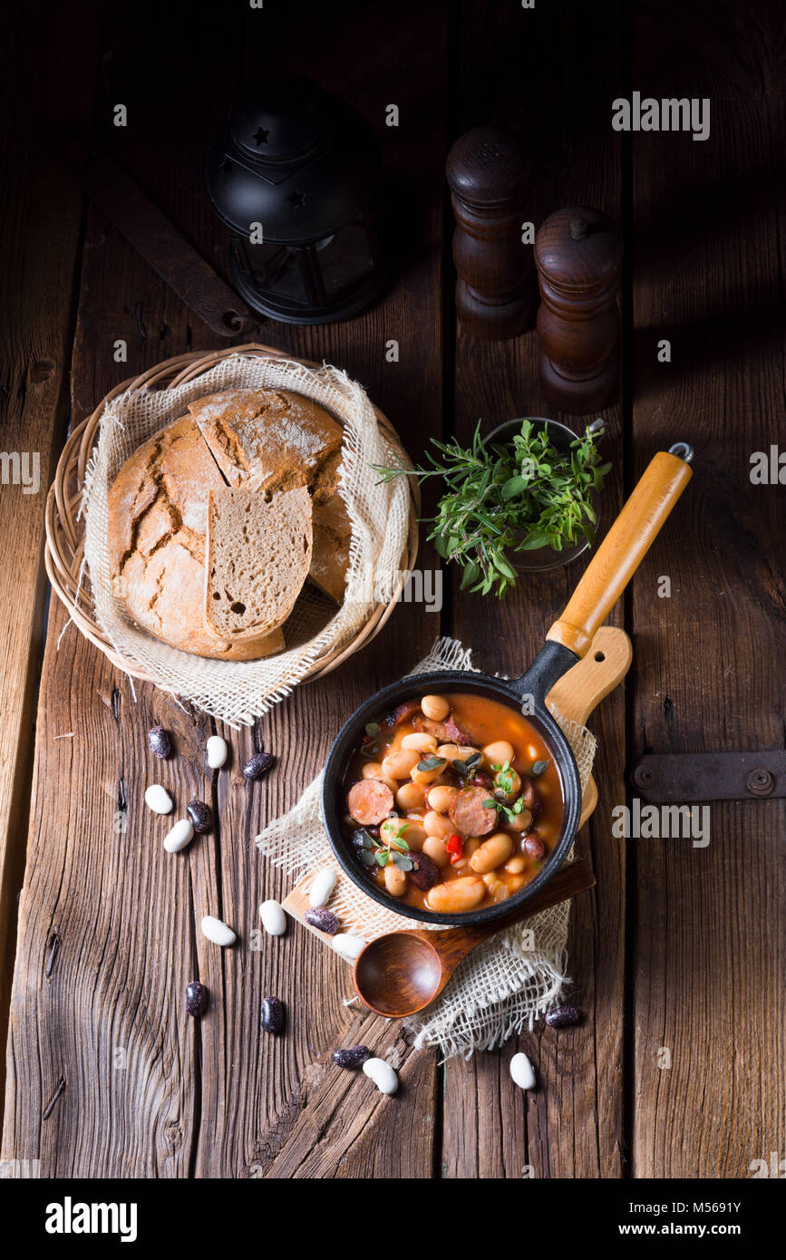 Polish Baked Beans with sausage Stock Photo Alamy