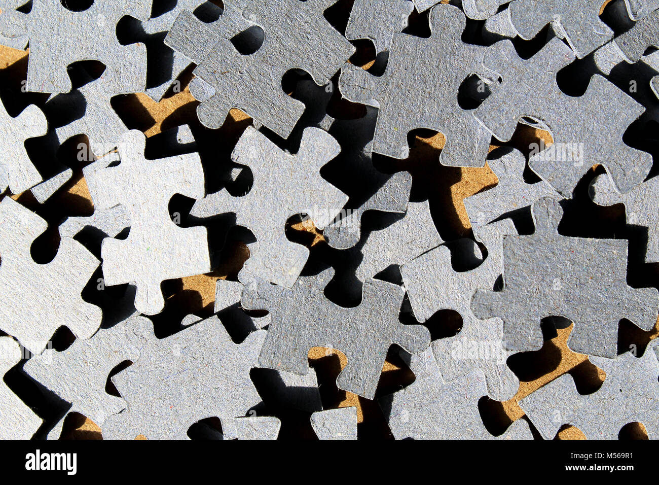 Cardboard puzzle pieces background texture Stock Photo - Alamy